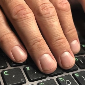 Fingernails on laptop